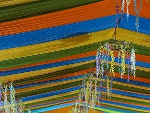 Striped multicolour canopy and hanging decorations, Agrani Socio Cultural Association