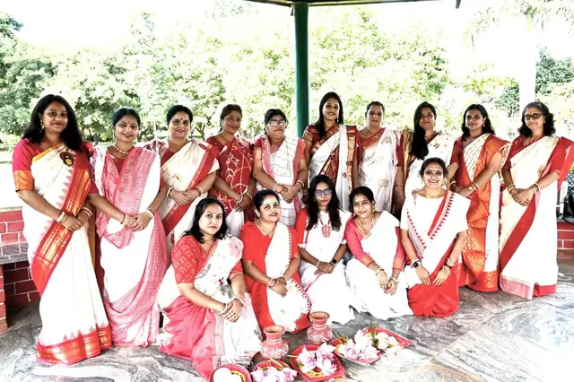 Group in traditional saris, Oikotan Hebbal Durgotsav Society